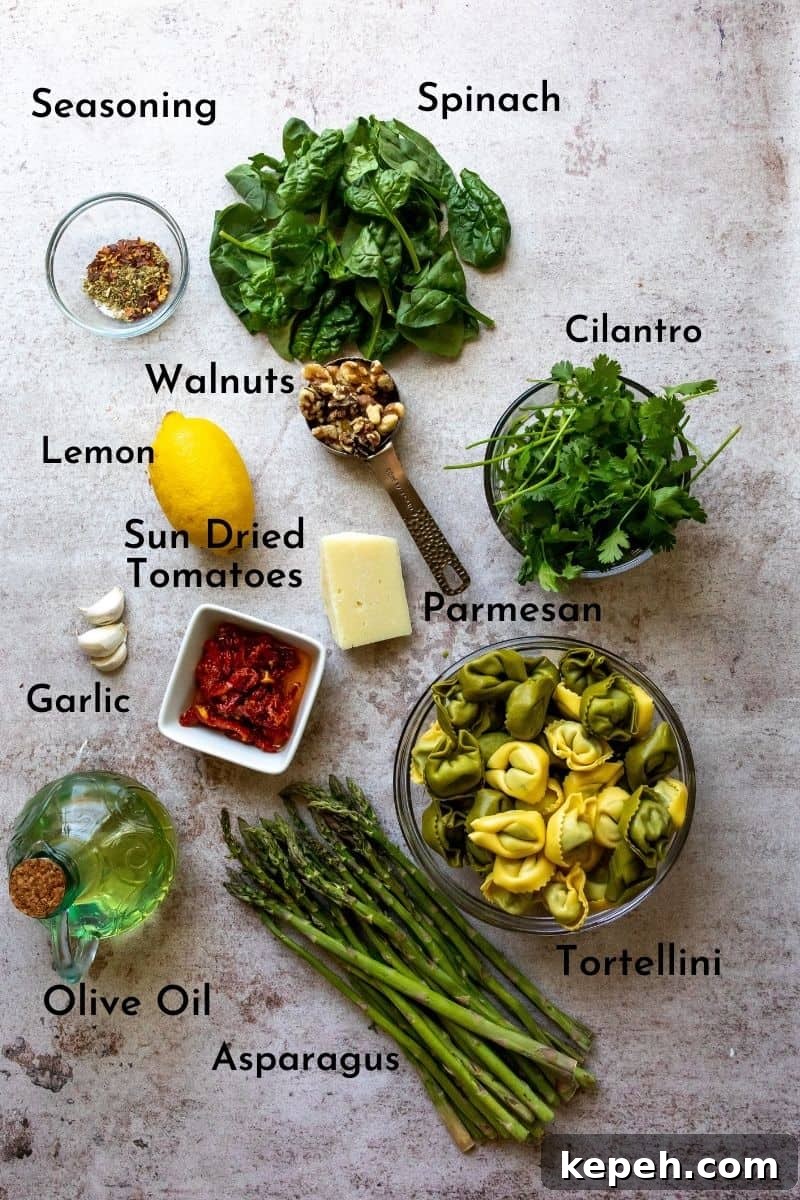 Pesto With Tortellini ingredients on a counter in bowls. 