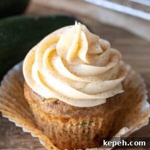 Zucchini cupcake with cream cheese frosting swirled on top