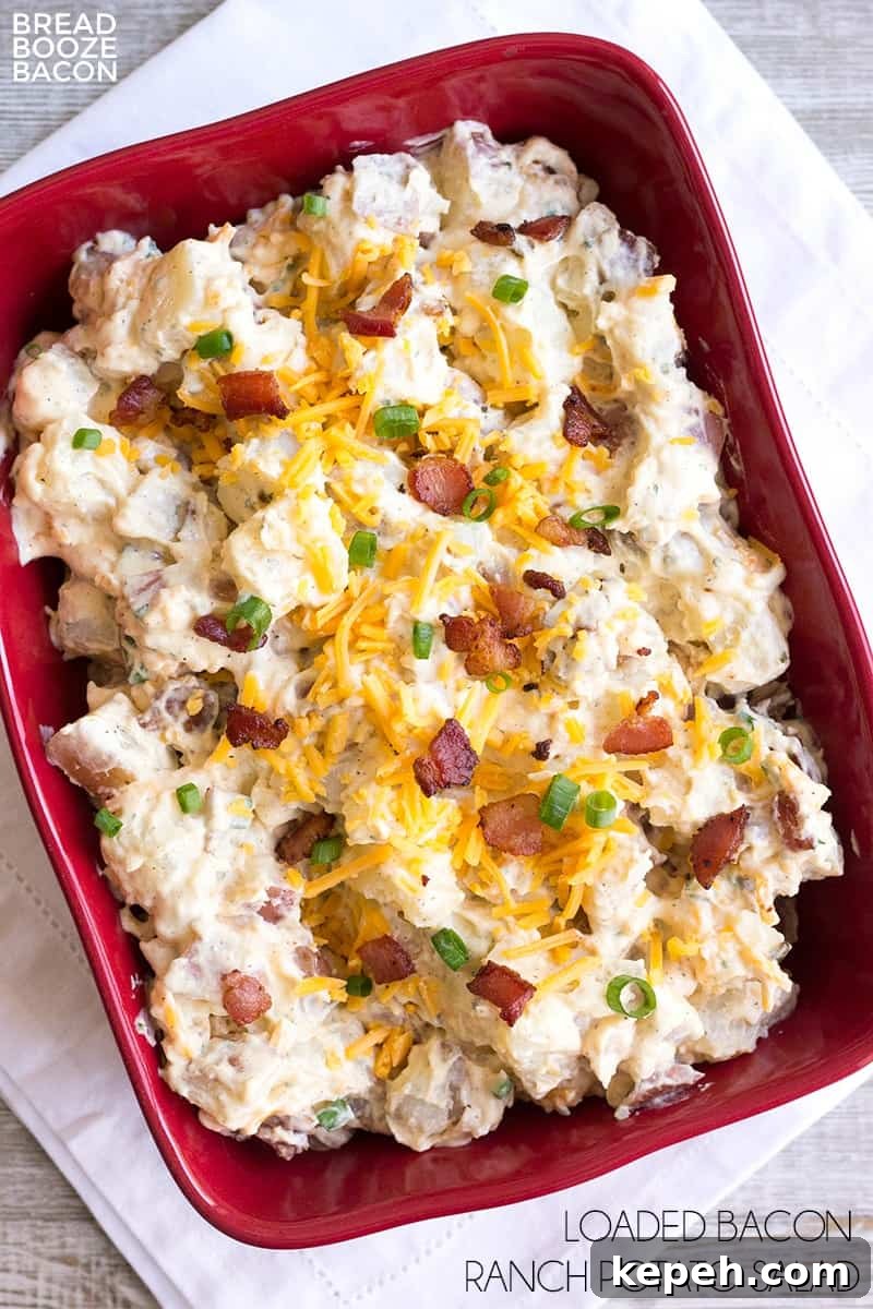 Loaded Bacon Ranch Potato Salad Recipe for Summer BBQs 2 Loaded Bacon Ranch Potato Salad is a flavorful side dish that's perfect for potlucks or your next game day party!