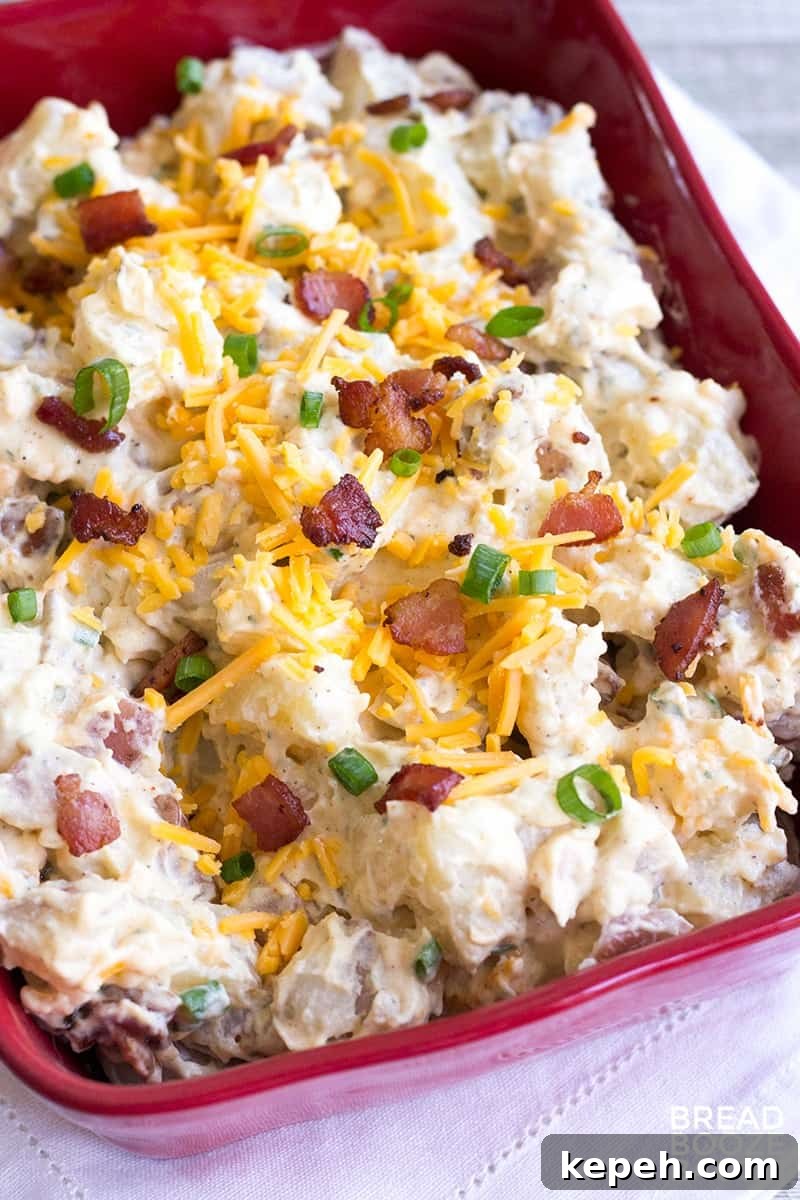 Loaded Bacon Ranch Potato Salad Recipe for Summer BBQs 4 Loaded Bacon Ranch Potato Salad is a flavorful side dish that's perfect for potlucks or your next game day party!