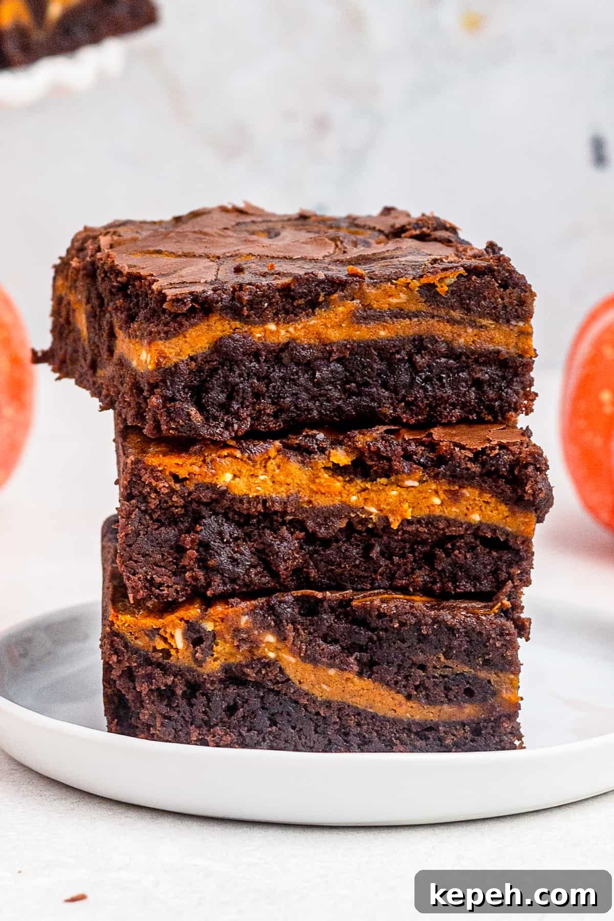 Chewy Pumpkin Brownies with Warm Spice and Chocolate Swirl 2 up close stacked pumpkin brownies