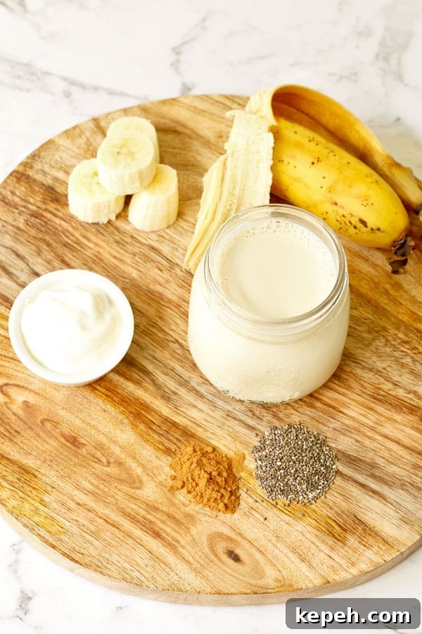 Creamy Chia Banana Yogurt Smoothie Recipe 3 ingredients for chia banana smoothie laid out on wooden board