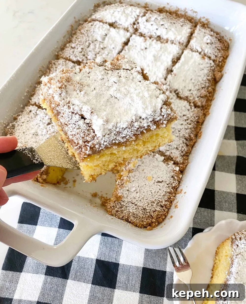 Starbucks Coffee Cake Copycat Recipe — Moist Streusel Coffee Cake 7 square of coffee cake on spatula