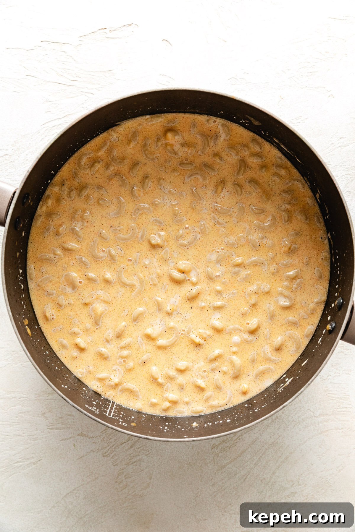 Elbow noodles mixed with cheesy custard.