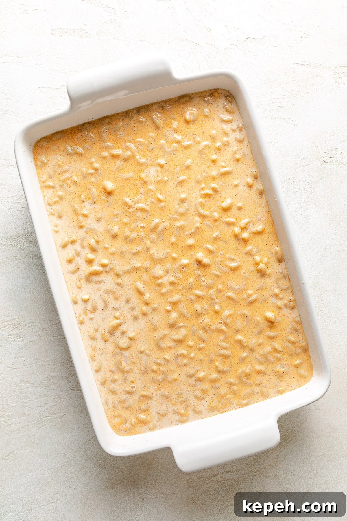 Unbaked mac and cheese in a pan