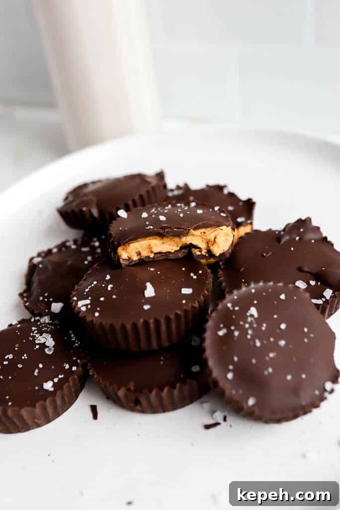 protein peanut butter cups recipe stacked on top of each other on white plate
