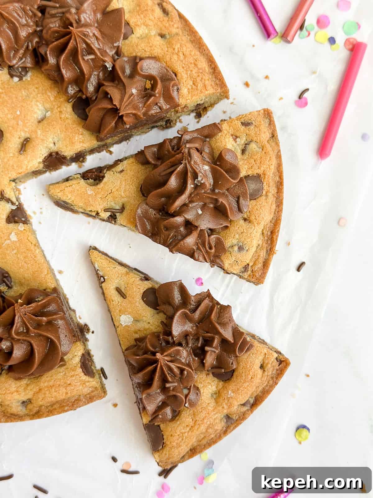 Chocolate Chip Cookie Cake Recipe: Soft, Gooey, Rich 11 a close up of 2 slices of the chocolate chip cookie cake.