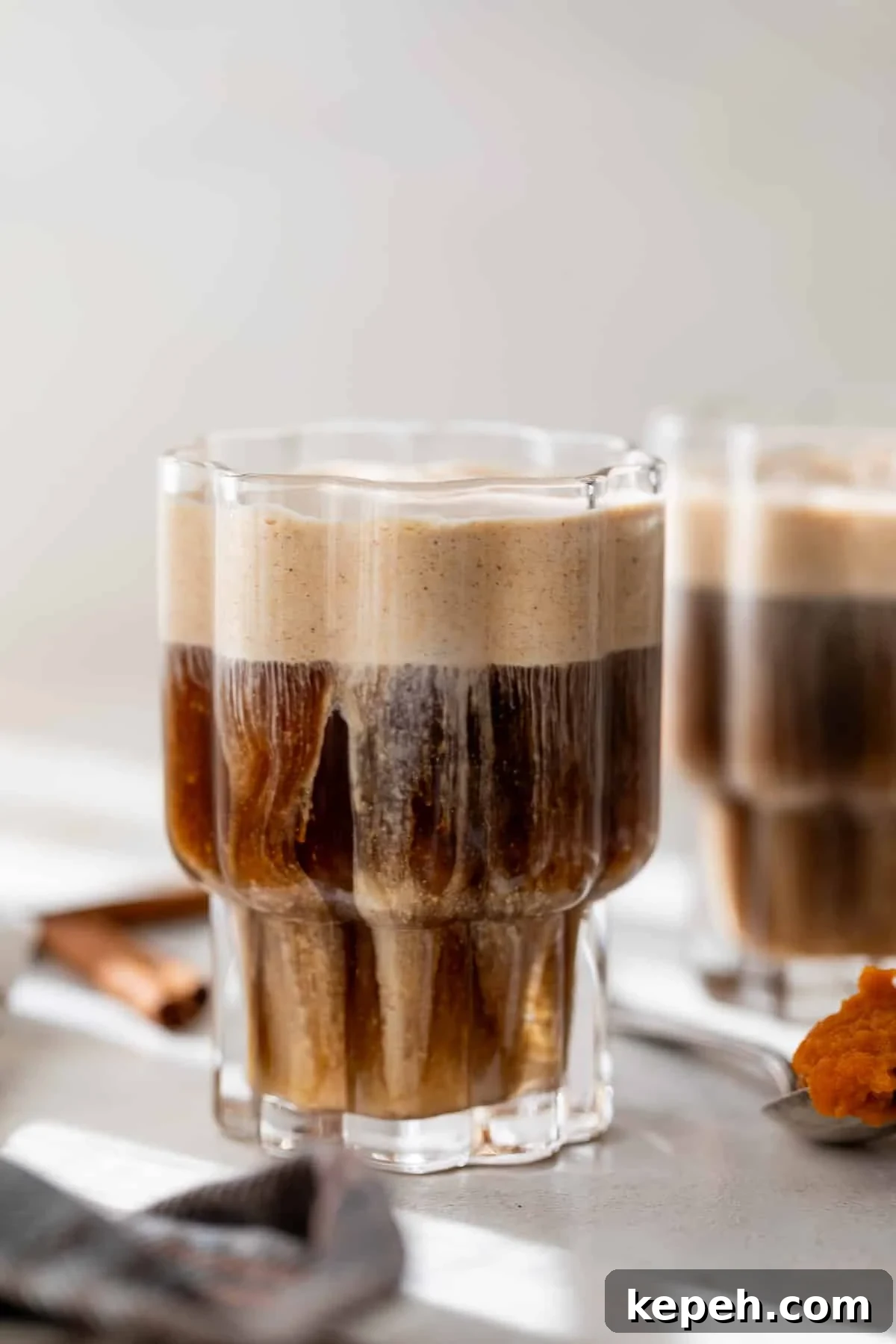 How to Make Pumpkin Cream Cold Brew 2 side view of a glass of pumpkin cream cold brew.