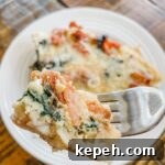 A fork digging into the Easy Weekend Breakfast Skillet