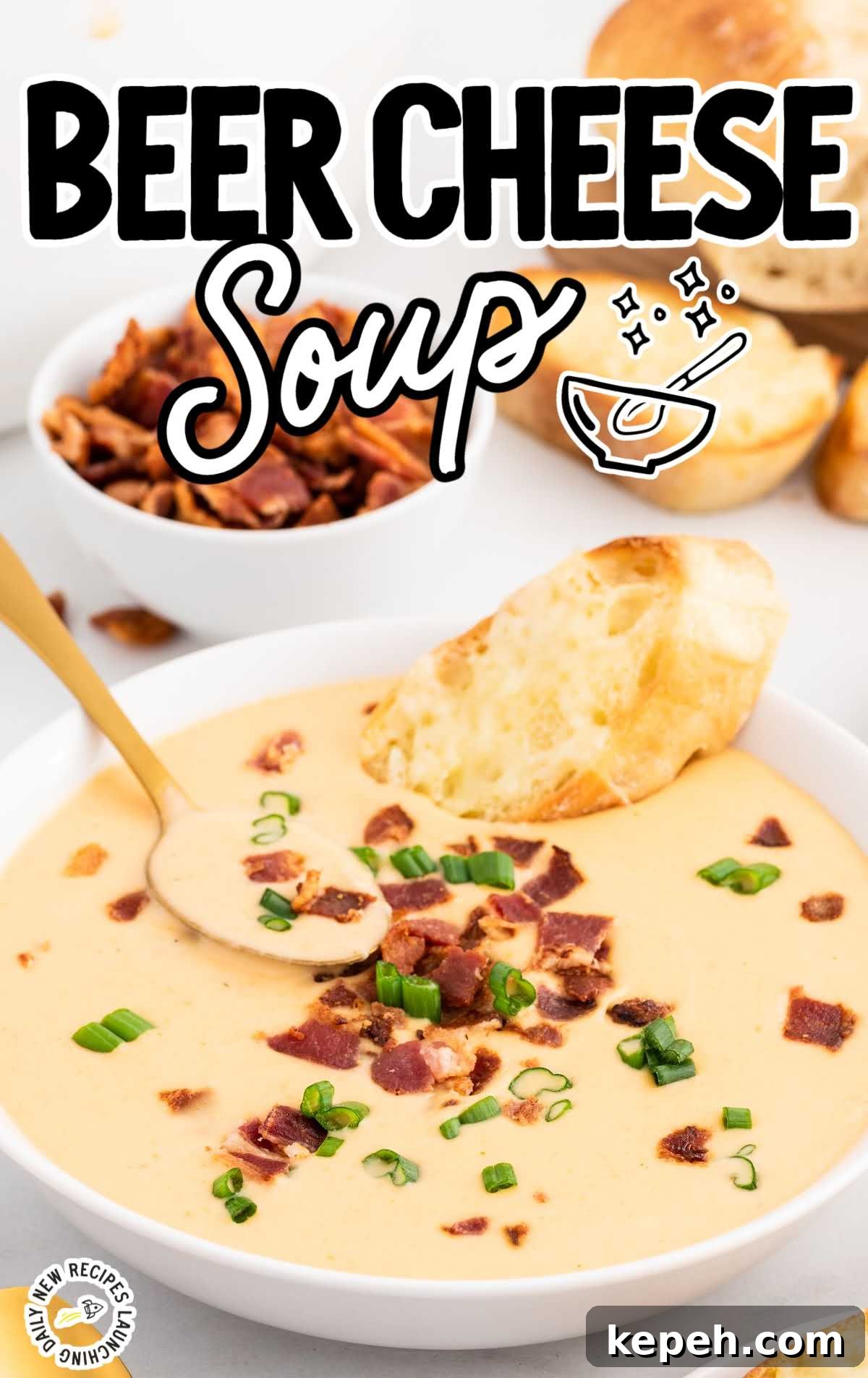close up shot of a bowl of Beer Cheese Soup topped with bacon bits and green onions with a slice of cheese bread
