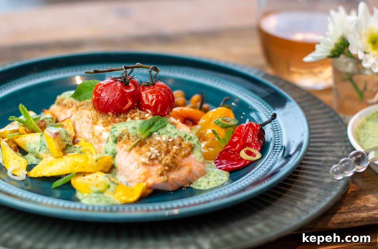 Egyptian Dukkah Sheet-Pan Salmon with Veggies and Chickpeas 12 Served with Minted Herb-Yogurt Sauce and Mint Leaves