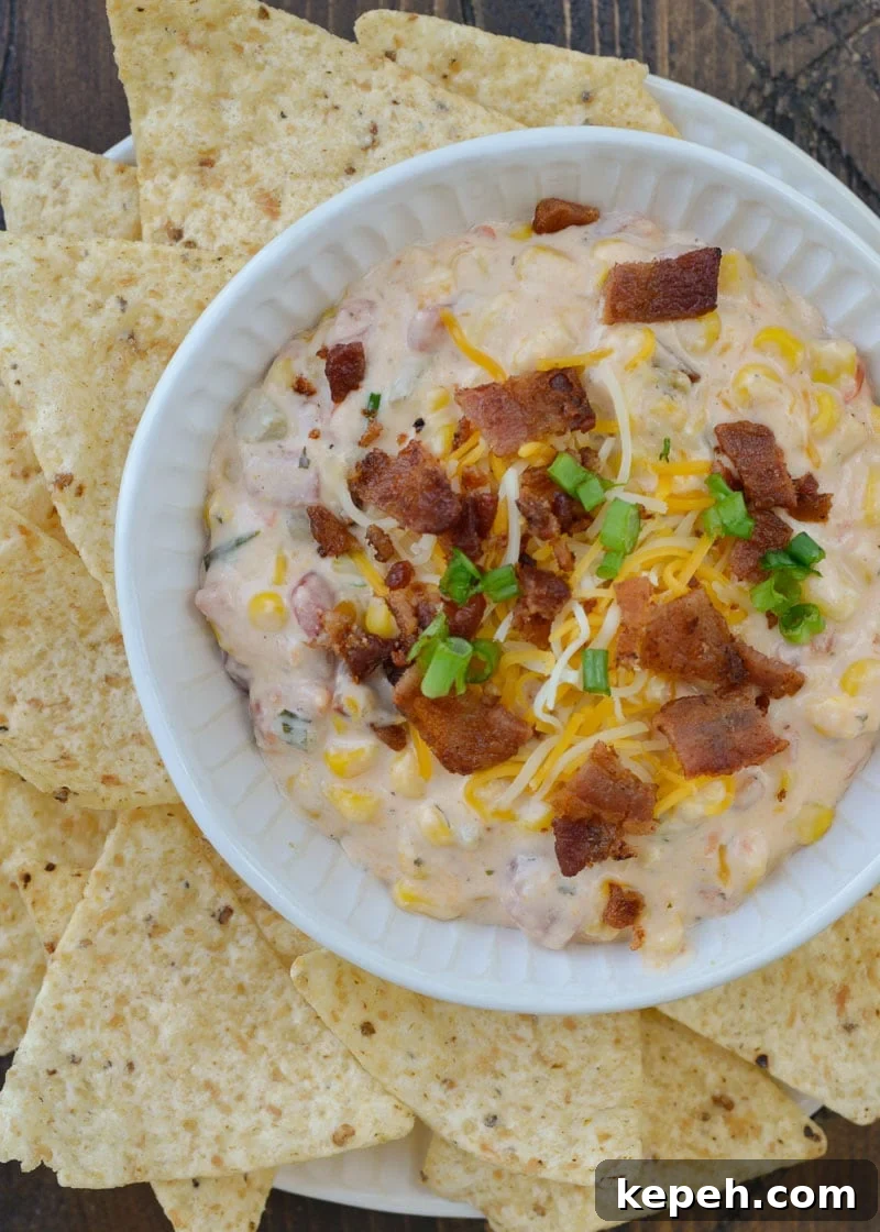 Creamy Slow Cooker Corn Dip 3 Slow Cooker Corn Dip makes for an impressive appetizer without any work! Just toss your ingredients in the slow cooker and come home to a creamy, cheesy dip!