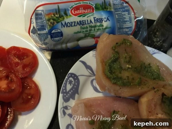 Adding pesto and mozzarella