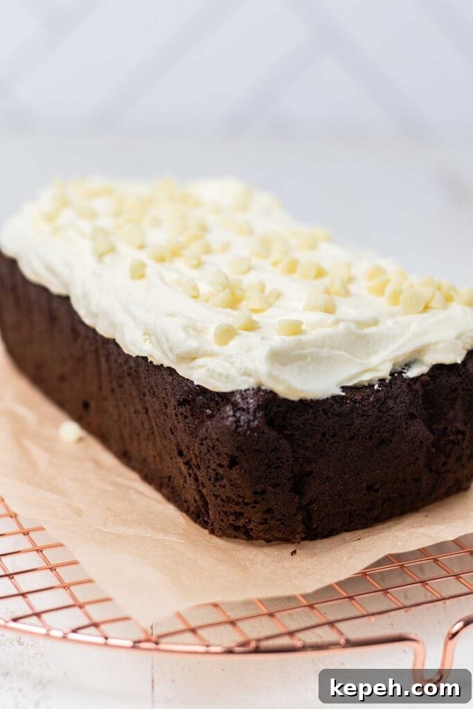 Moist Gluten-Free Gingerbread Loaf Recipe 8 A cooled gingerbread cake topped with a thick layer of white chocolate mascarpone.