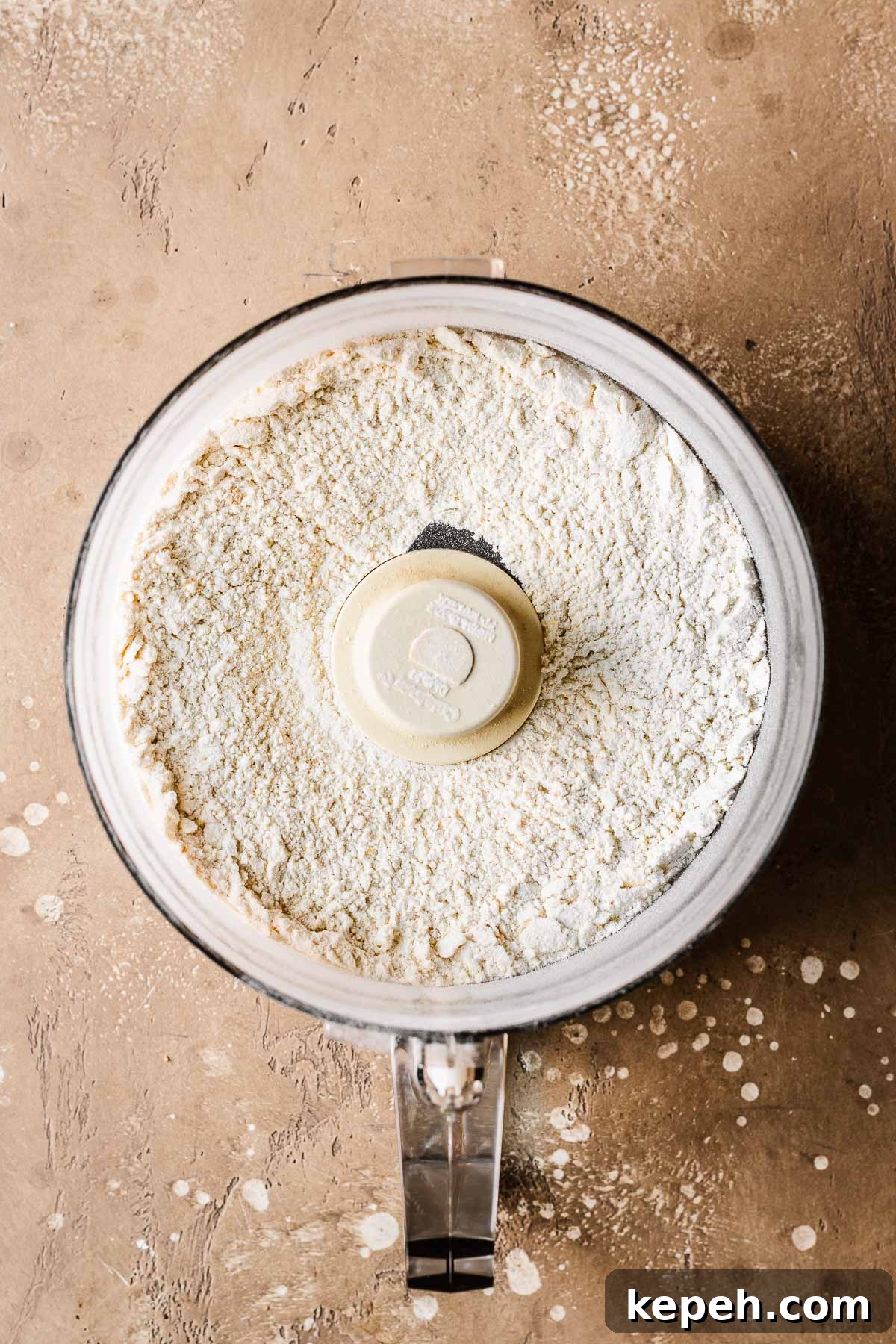 Dry ingredients for cookie dough in a food processor.