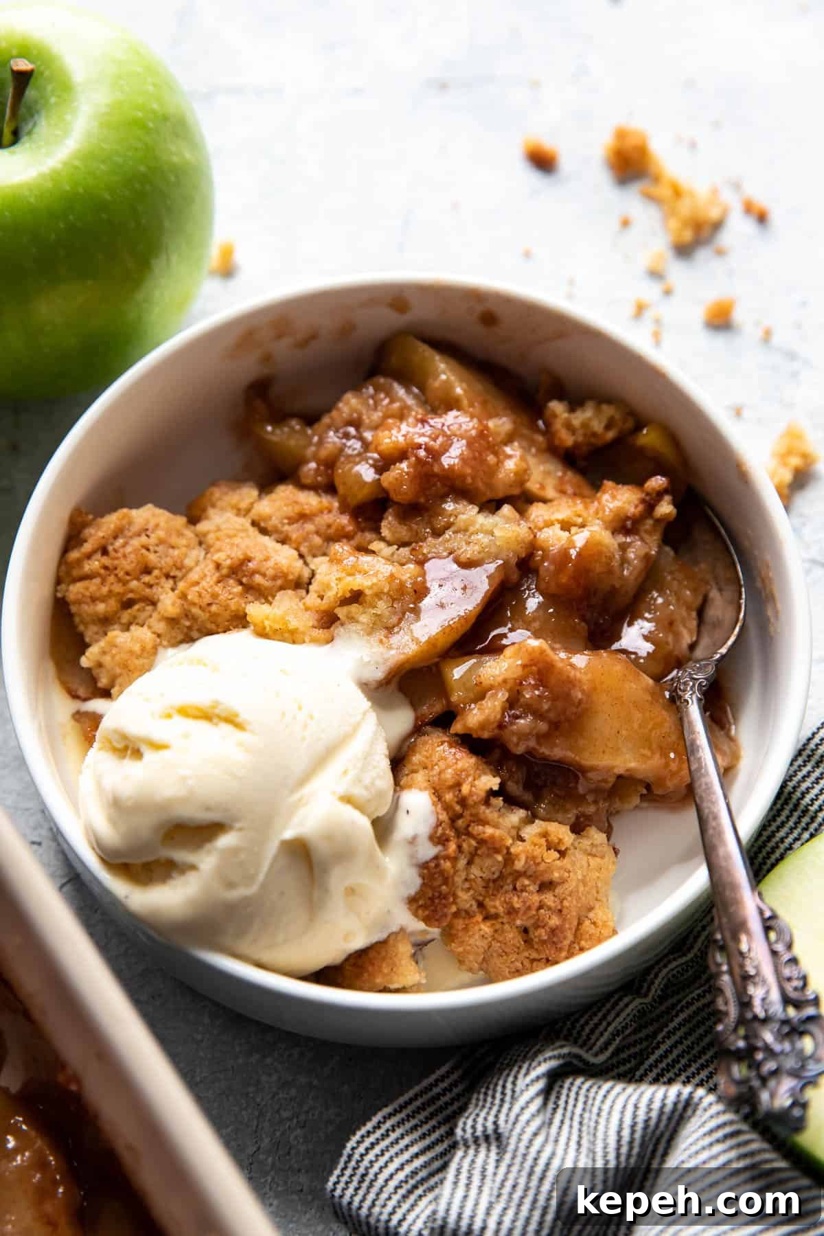 Classic Homemade Apple Cobbler with Cinnamon Crumble 11 apple cobbler in a bowl.